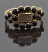Georgian / Victorian mourning ring set with plaited hair in a glass compartment surrounded by French