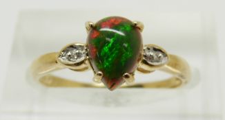 A 9ct gold ring set with a pear cut Mezezo opal and diamonds, 1.6g, size M