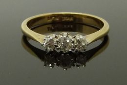 An 18ct gold ring set with three diamonds, size J/K, 2.22g