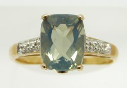 A 9ct gold ring set with a cushion cut blue fire opal and diamonds, 2.2g, size N