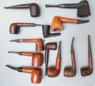 A collection of wooden smoking pipes including Grosvenor, St Claude, Loewe and Colby, Ford T,
