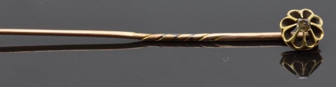 Victorian yellow metal stick pin set with a rose cut diamond