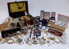 A collection of costume jewellery including beads, brooches, watches including Timex, Citizen, etc