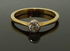 An 18ct gold ring set with a diamond of approximately 0.25ct, size M, 2.29g
