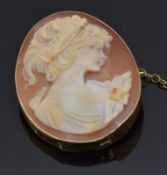 A 9ct gold brooch set with a cameo of a young woman, 3.7 x 2.7cm
