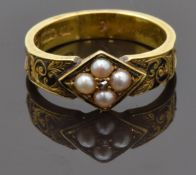Victorian 15ct gold mourning ring set with a diamond surrounded by split pearls, black enamel to the