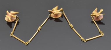 A set of three Victorian collar studs set with swallows, joined by a chain, in original box