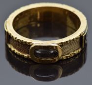 Victorian mourning ring set with plaited hair in a glass compartment, around the band rectangular
