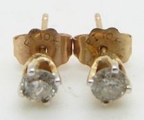 Pair of 9ct gold earrings each set with a diamond measuring approximately 0.12ct