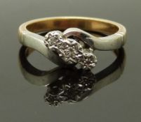A 9ct gold ring set with three diamonds in a platinum setting, size K/L, 3.8g
