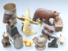 Carved Black Forest bears, brass aeroplane, table lighter, collectables including Art Deco napkin