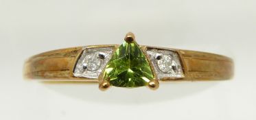 A 9ct gold ring set with a trilliant cut tourmaline and diamonds, 1.7g, size N