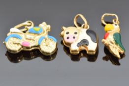 Three 9ct gold and enamel charms, one in the form of a cow, one a parrot and the other a
