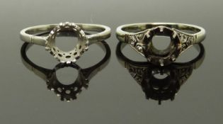 A platinum ring mount and a white gold ring mount set with diamond shoulders, size L & M, 5.00g