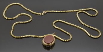 A 9ct gold double sided hardstone locket (6g) on a 9ct gold chain/ necklace (25g)