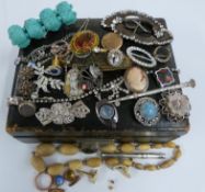 A collection of jewellery including Arts & Crafts silver pendant set with a moonstone and ruby,