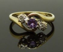 A 9ct gold ring set with an amethyst and diamonds, size H, 1.99g