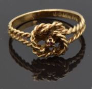 A 9ct gold knot ring in a Bakelite Bravingtons box, size J, 1.45g