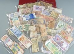 An amateur collection of world banknotes, in an album