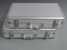 Two aluminium coin collector's cases