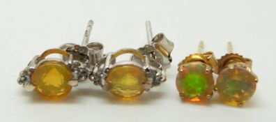 Two pairs of 9ct gold earrings each set with opals