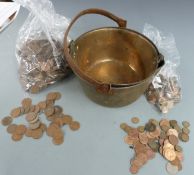 A large quantity of UK sundry coinage and pennies contained in two brass cooking pans