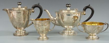 Mappin and Webb George V hallmarked silver four piece tea set, the sugar bowl and milk jug with gilt