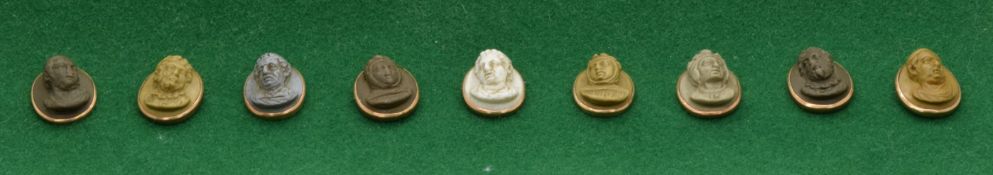 A set of nine Victorian lava cameo buttons, each set with oval vari-coloured lava cameo panels