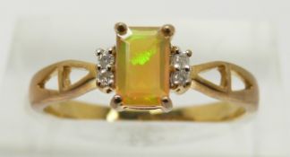 A 9ct gold ring set with an emerald cut opal and diamonds, 1.8g, size N