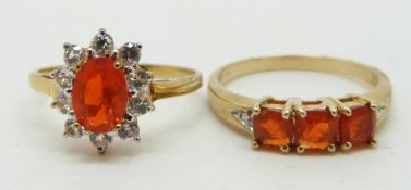 A 9ct gold ring set with three cushion cut Mexican fire opals and diamonds and a 9ct gold ring set
