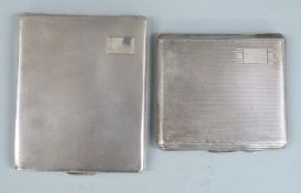 Two hallmarked silver cigarette cases, both with engine turned decoration, weight 266g all in