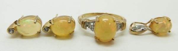 A 9ct gold ring set with an an opal cabochon and diamonds (size N), a similar pendant and earrings