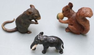 Three Austrian cold painted bronze animals comprising elephant, squirrel with acorn and a mouse,