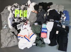 A large quantity of Victoria's Secret 'Pink' ladies clothing including leggings, hoodies and tops.