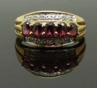 A 9ct gold ring set with garnets and diamonds, size L, 2.26g