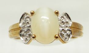 A 9ct gold ring set with an oval cat's eye opal cabochon and diamonds, 3.3g, size N