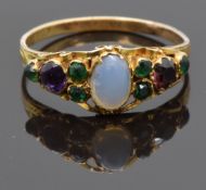 Victorian yellow metal ring set with a moonstone, emeralds and amethyst, size L