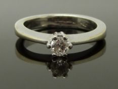 An 18ct white gold ring set with a diamond of approximately 0.2ct, size I, 4.72g