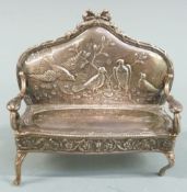 Novelty Edward VII hallmarked silver doll's house sofa having embossed decoration of birds to the