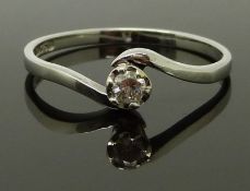 A 9ct white gold ring set with a diamond in a twist setting, size P/Q, 1.72g