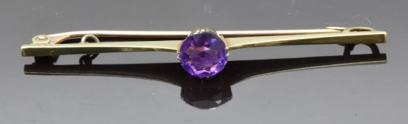 A 9ct gold brooch set with a round cut amethyst