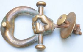 19thC brass hand door knocker with plate and fittings, height 15cm