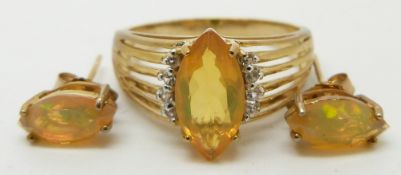 A 9ct gold ring set with a marquise cut opal (size R/S) with matching earrings