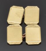 A pair of 9ct gold cufflinks with engine turned and engraved decoration, 5.9g in original box