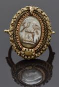 Georgian mourning ring set with an ivory plaque depicting a gravestone and two doves, surrounded