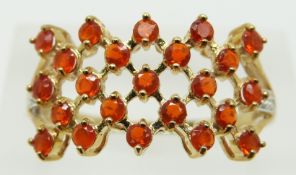 A 9ct gold ring set with fire opals and diamonds, 2.2g, size S