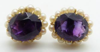 A pair of 9ct gold earrings set with an oval cut amethyst surrounded by seed pearls, 4.7g
