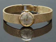 Omega 9ct gold ladies wristwatch ref.711.5603 with black hands, gold baton markers, silver dial