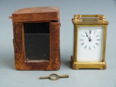 Late 19thC French brass carriage clock in corniche style case, the enamelled Roman dial with blued