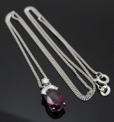 An 18ct white gold pendant set with an oval cut ruby measuring approximately 1.8ct, a square cut
